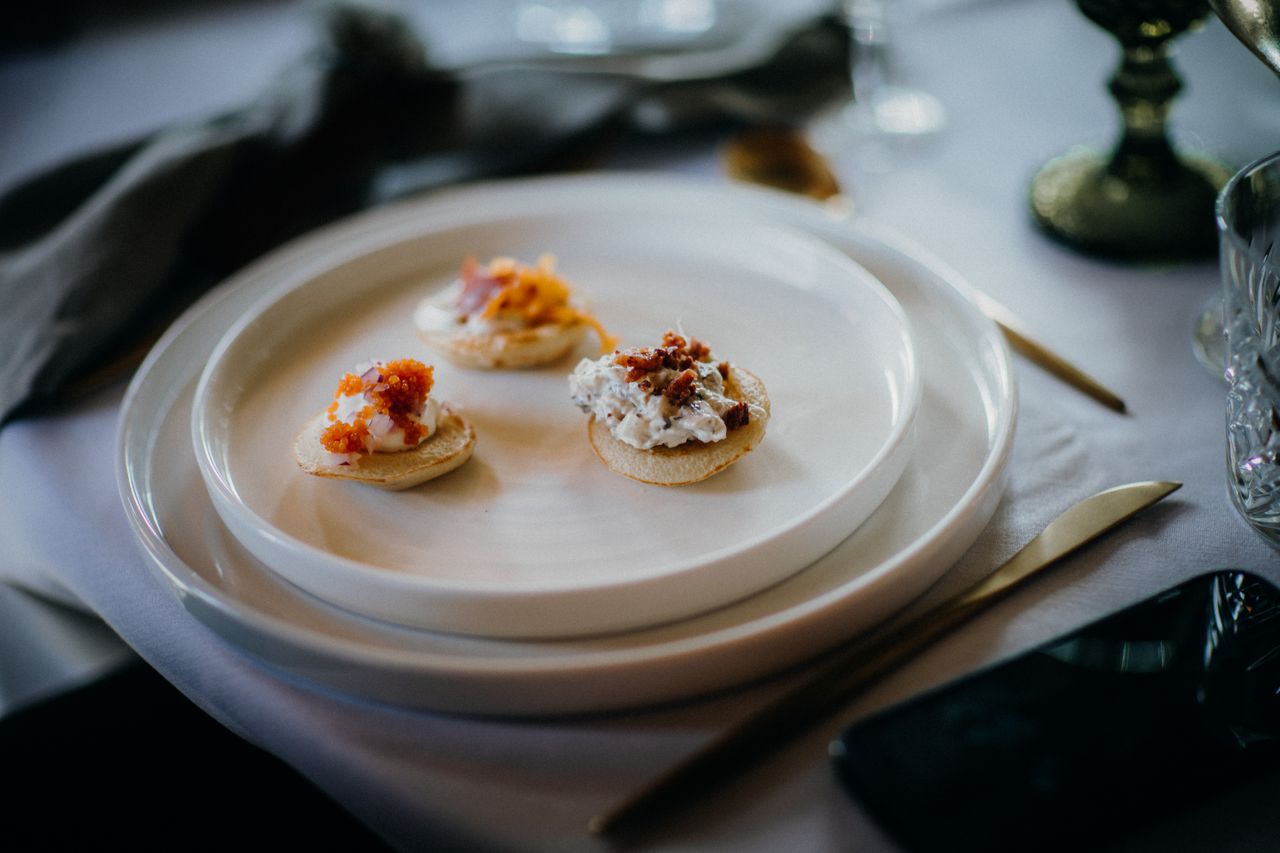 Crafting Captivating Headlines: Your awesome post title goes here Close-up of elegant white plates with gourmet canapés. Ideal for culinary or restaurant themes.