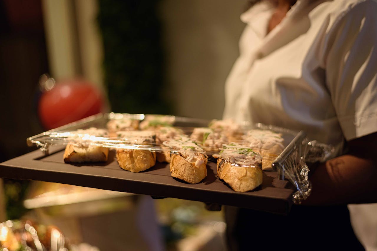 Tray of fresh appetizers served by a waiter during an event in Enugu, Nigeria.