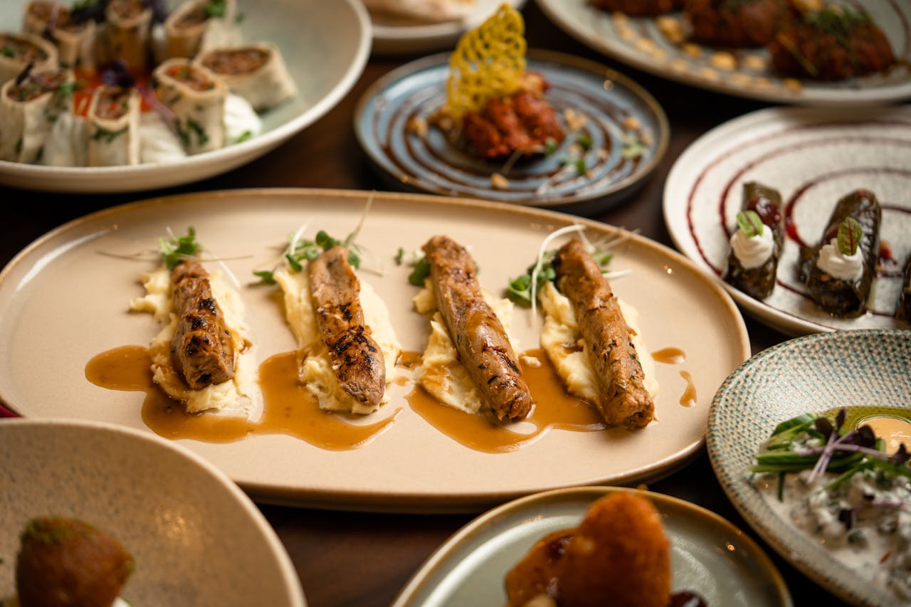 Elegant presentation of a variety of gourmet dishes on a dining table.